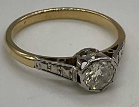 An 18ct yellow gold diamond solitaire ring, the round brilliant cut stone weighing approx. 0.