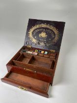 WINSOR & NEWTON; a 19th century mahogany paint box with labels to the interior and traces of the
