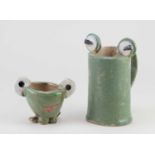 LILYAH, age 9; 'Froggy', a stoneware mug covered in green glaze with applied 'frog eyes' to the rim,