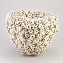 VANESSA HOGGE (born 1963); 'Daffodil Vessel', a porcelain vessel covered in sculpted flower heads,