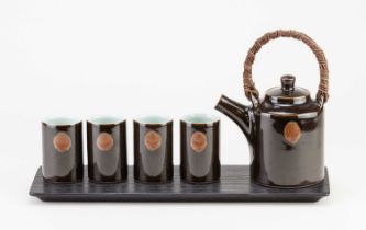 CHRIS KEENAN (born 1960); a Limoges porcelain tea set on a wooden tray comprising a teapot with cane