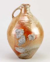 NIC COLLINS (born 1958); a wood-fired stoneware flagon covered in ash and shino glaze, side fired on