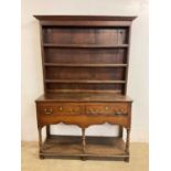 A small Georgian oak pot board dresser with two drawers with brass handles, top with three