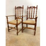 A pair of early 20th century oak open arm chairs, seat height 50cm.Dimensions: Seat height 50cm