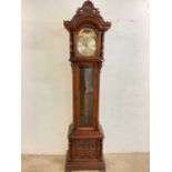 A contemporary triple weight longcase clock, height 208cm.