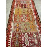 A large vintage Turkish Kilim rug, 320 x 152cm.Dimensions: 320cm x 152cm.