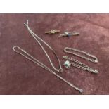 Two 9ct yellow gold necklaces, two 9ct gold bracelets, a 9ct gold brooch (total 22.7g) and a 15ct