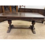 An oak draw-leaf table also with other associated furniture, table when extended approx height 76cm,