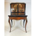 A late 19th century Boulle work lady's desk raised on cabriole legs with gilt metal mounts,