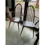 A pair of Ercol mid century Quaker bow back dining chairs with elm seats, unmarked and without