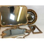 Four small mirrors, including a shaped bevelled example in ornate gilt frame, a porthole type