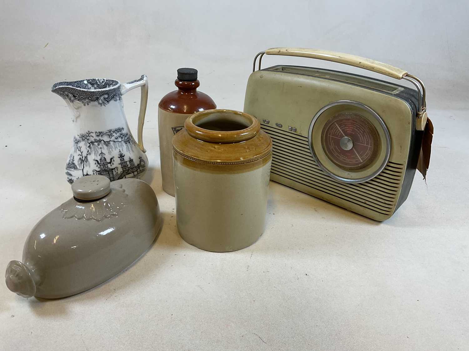 A vintage Bush Radio, three stoneware items and a transfer printed jug