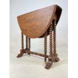 A late Victorain walnut Sutherland table of small proportions.55cm h x 59cm d x 69cm w (flaps up)