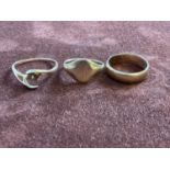 Three gold rings, two 9ct yellow gold, combined 5g, and a ring marked 14ct, 2g.