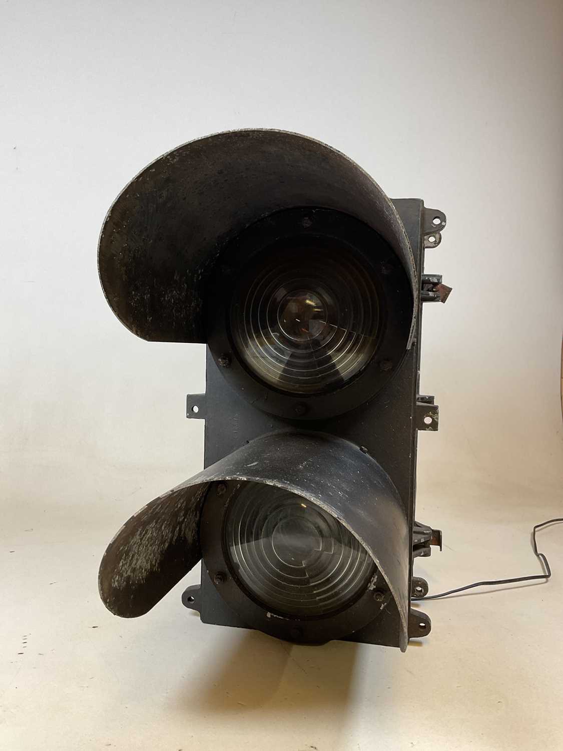 A large railway double light with stepped lenses and hood canopies, height 60m.