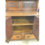 A two piece oak Continental dresser, height 196cm, width 126cm, depth 63cm.