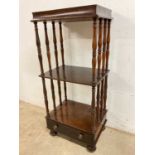 An early 20th century three tier whatnot with drawer to base with turned supports and gallery to