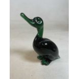 A mid 20th century green glass duck model of a duck, height 24cm (af) Condition Report: chip to tail