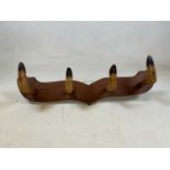 A coat rack fashioned from 4 deer hoovesDimensions: W: 65cm