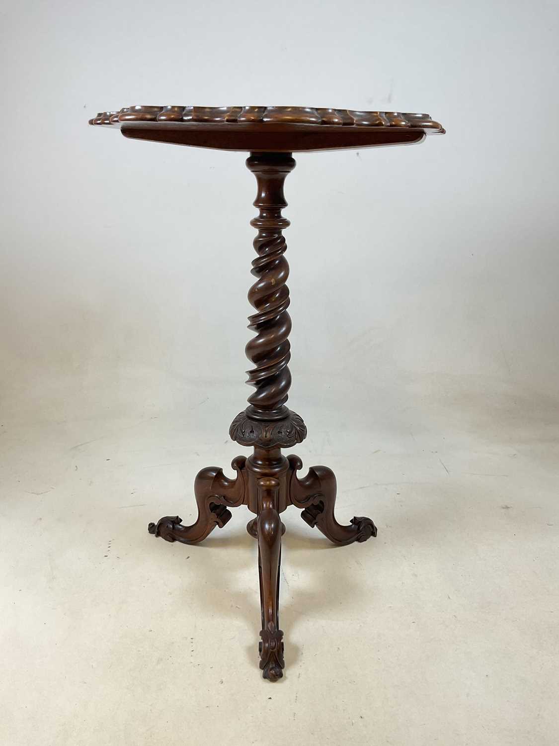 A Victorian walnut barley twist occasional table with a circular top and curved tripod base 73cm h x