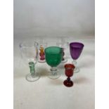 A collection of glasses including hand blown glasses and rummers