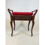 An Edwardian mahogany piano stool.