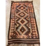 A Kilim rug made from camel hair, 177cm x 100cm.
