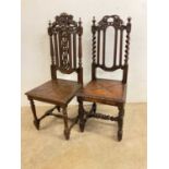 Two carved oak hall chairs.