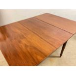 A late 19th/early 20th century drop-leaf mahogany dining table, height 72cm, width 118cm, depth