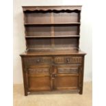 A reproduction two piece Welsh dresser by Jaycee, height 174cm, width 123cm.Dimensions: w 123cm x