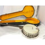 JOHN GREY & SONS OF LONDON; a cased four string banjo with mother of pearl inlay to the fret, length
