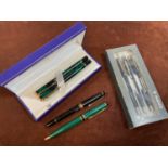 A group of pens, including a Mont Blanc fountain pen 'MG1555134', a pair of boxed Waterman pens, a