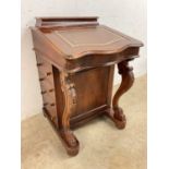 A 20th century mahogany Davenport with interior desk and a leather writing slope, height 84cm, width