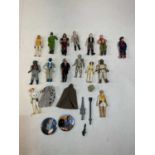 A group of original plastic Star Wars figures including Hans Solo, Princess Leia and Luke