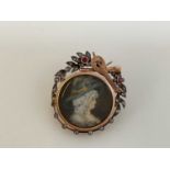 FELIX MENDELSSOHN INTEREST; a yellow metal ruby and diamond brooch centred with a portrait of a