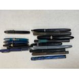 A group of vintage pens, including a Parker 17, a blue bodied Parker Victory, etc.
