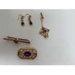 A 9ct yellow gold and amethyst pierced rectangular brooch, width 25mm, a 9ct gold bar brooch set