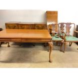 WARING & GILLOW; a walnut veneered dining room suite, comprising extending table, sideboard, and