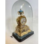 A late 19th century French gilt metal and porcelain mounted eight day mantel clock presented on a