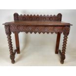 A carved Victorian hall table, height 92cm, width 104cm, depth 44cm.