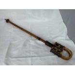 A vintage bamboo shooting stick