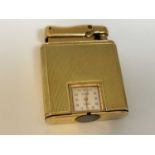 COLIBRI; a 9ct gold cased 'Monopol' lighter inset with a seventeen jewel watch movement, in simple