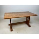 A rectangular oak coffee table, modelled as a refectory table 45cm h x 91cm w x 48cm d