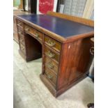 An early 20th century twin pedestal nine drawer desk, locks marked Hobbs and Co London, height 76cm,