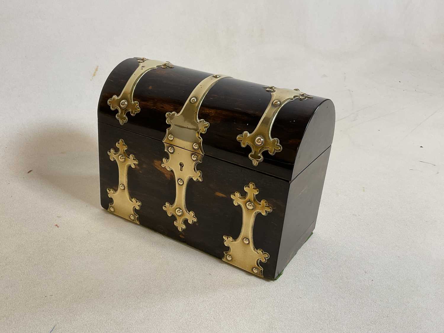 A Victorian coromandel veneered and brass strap detailed dome topped box, width 22cm, also a small