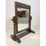 A small early/mid 20th century oak swing toilet mirror.