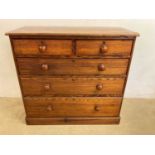 A 20th century pitch pine chest of drawers, two short over three long drawers, height 98cm, width