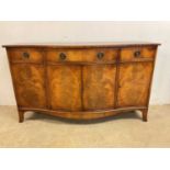 A reproduction serpentine sideboard 88cm h x 152cm w x 49cm d