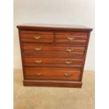 A 20th century chest of drawers with two short over three long drawers with brass handles, height