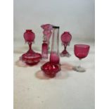 A small group of cranberry glass